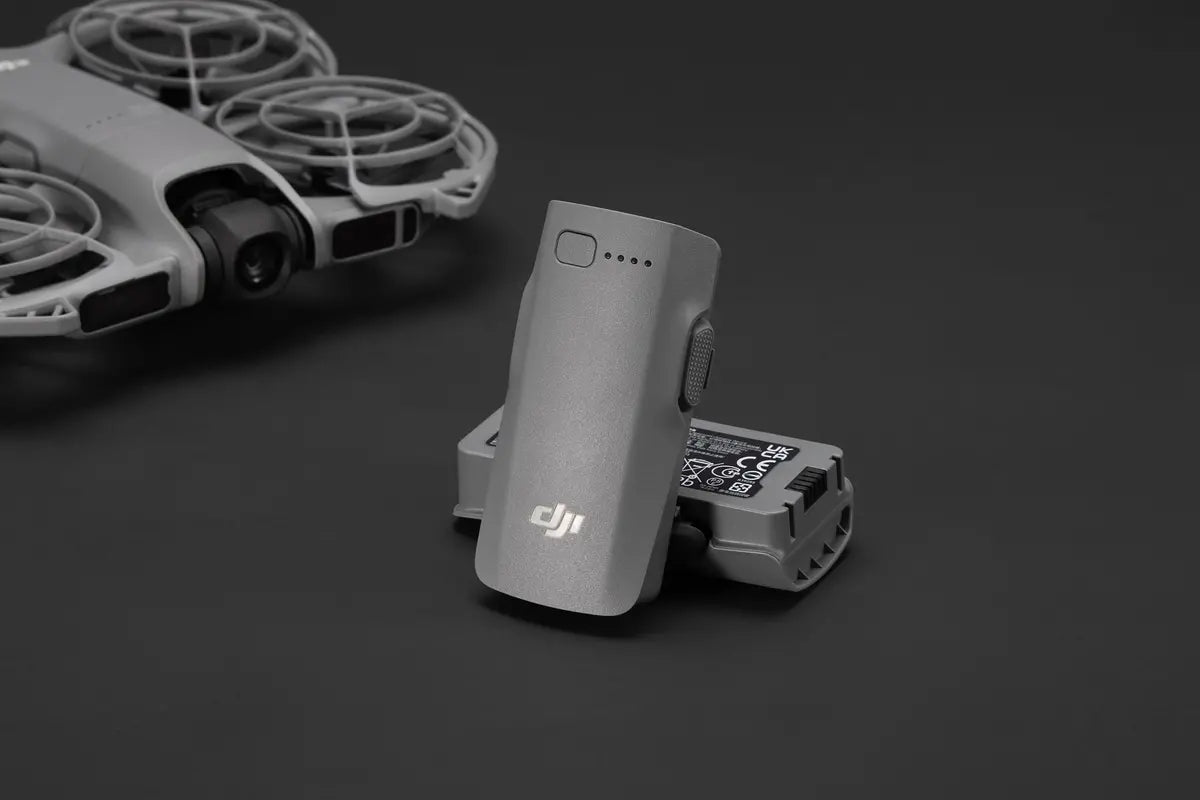 DJI Neo 2 Intelligent Flight Battery alongside the drone, showcasing its compact design and efficiency.