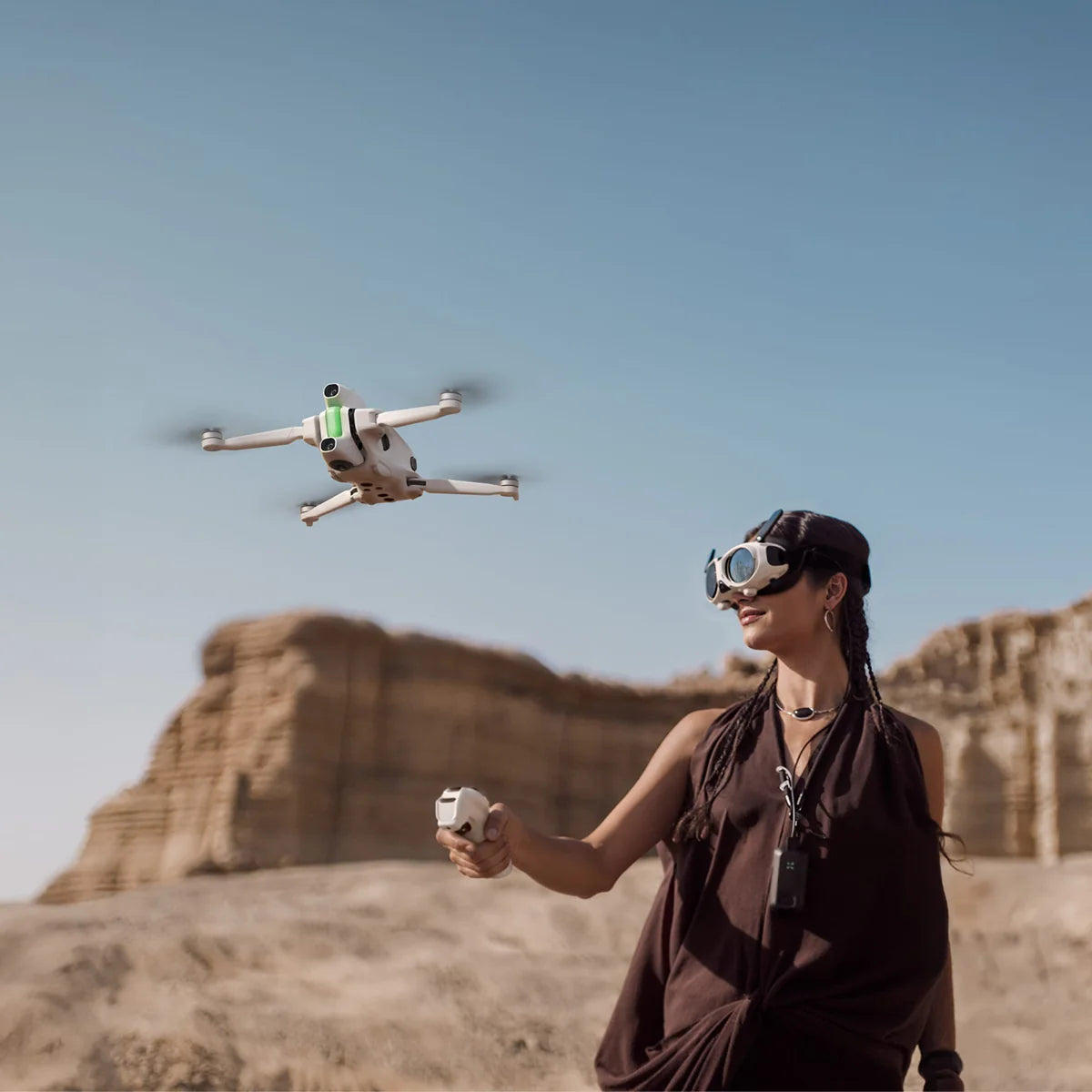 pic of person flying the Antigravity A1 8K 360 Drone wearing drone goggles in the desert