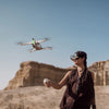 pic of person flying the Antigravity A1 8K 360 Drone wearing drone goggles in the desert